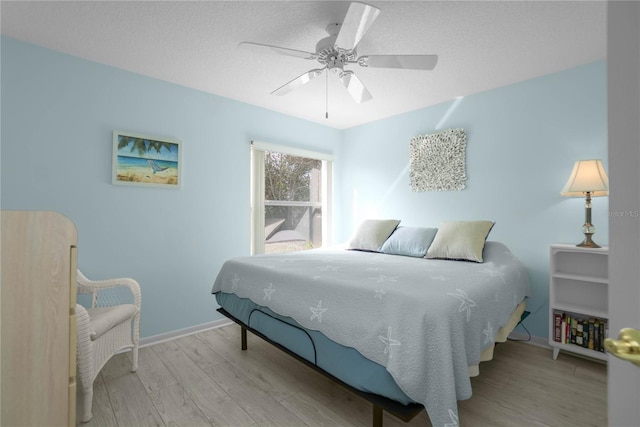 3656 E Lake Todd Dr, Hernando, FL 34442 - bedroom featuring wood finished floors, baseboards, and a ceiling fan