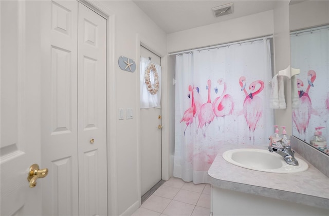 3656 E Lake Todd Dr, Hernando, FL 34442 - bathroom with vanity, tile patterned flooring, and a closet