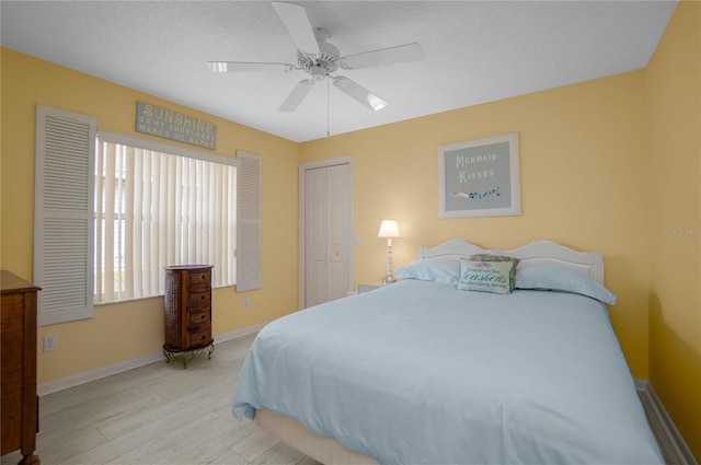 3656 E Lake Todd Dr, Hernando, FL 34442 - bedroom featuring wood finished floors, a closet, baseboards, and a ceiling fan