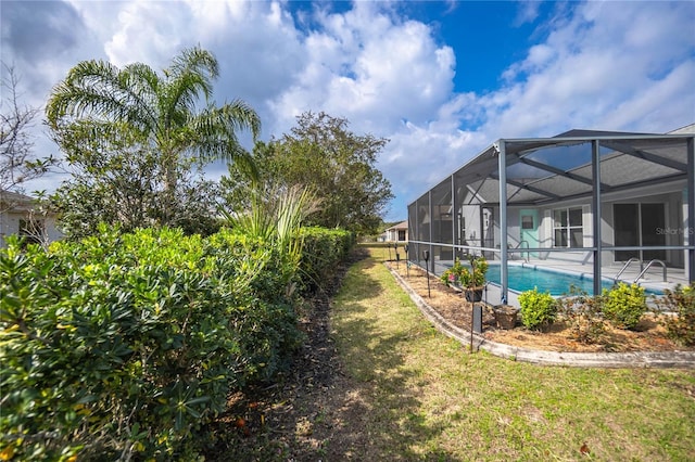 3656 E Lake Todd Dr, Hernando, FL 34442 - view of green lawn with an outdoor pool, a lanai, and a patio area
