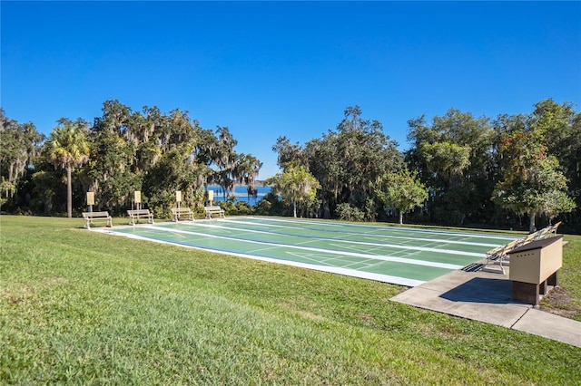3656 E Lake Todd Dr, Hernando, FL 34442 - view of home's community with shuffleboard, a yard, and view of scattered trees