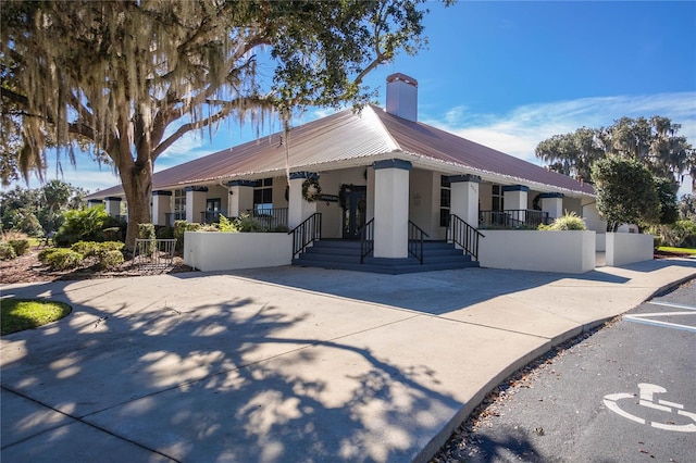 3656 E Lake Todd Dr, Hernando, FL 34442 - view of front of house with a porch and metal roof