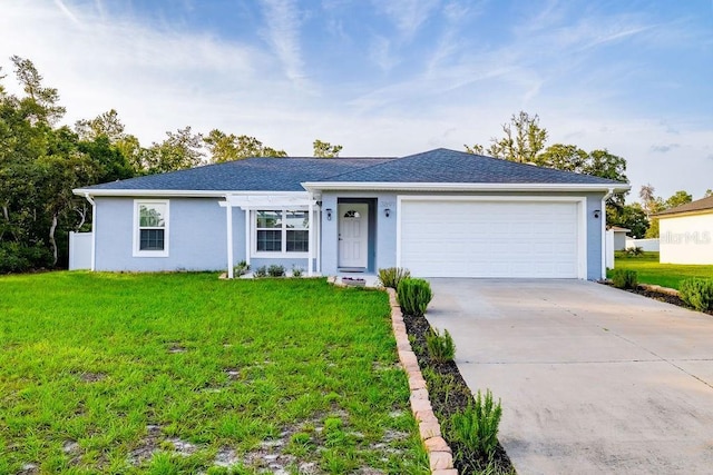3897 SW 169th Lane Rd, Ocala, FL 34473 - ranch-style house featuring concrete driveway, a front lawn, a garage, and stucco siding