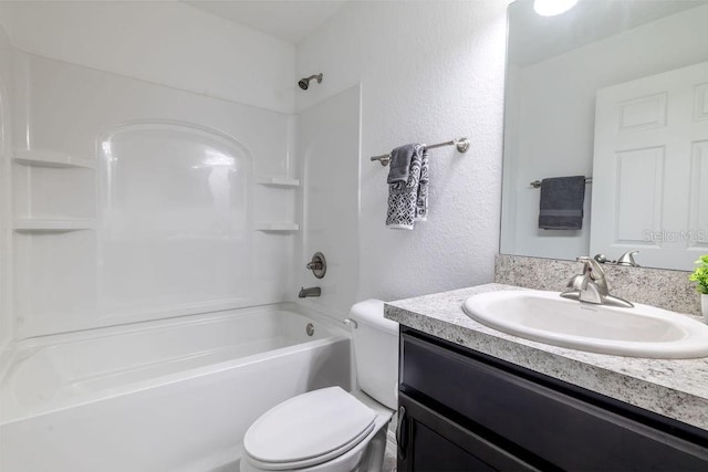 3897 SW 169th Lane Rd, Ocala, FL 34473 - full bathroom with vanity, toilet, shower / bathtub combination, and a textured wall