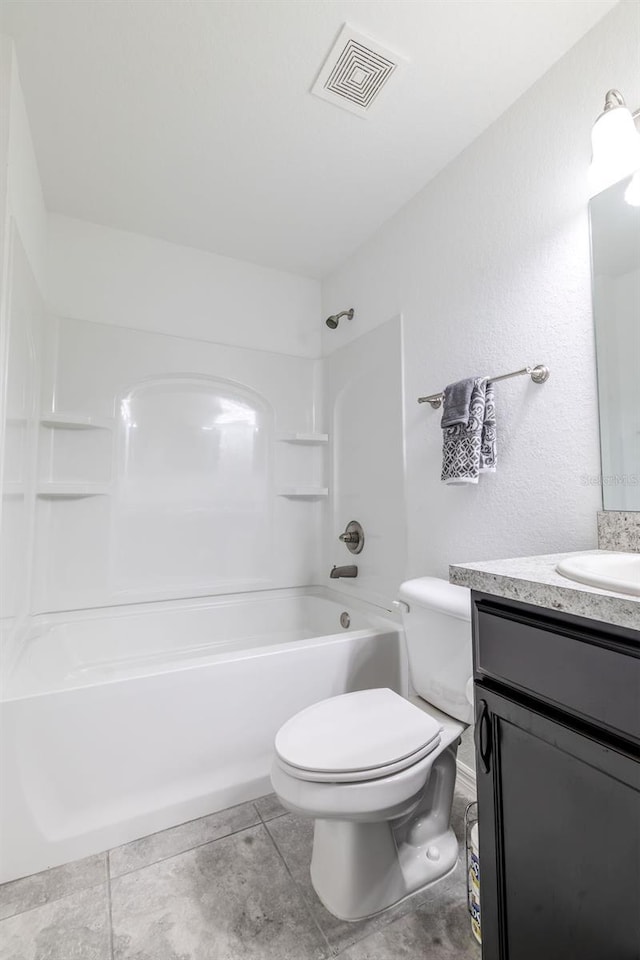 3897 SW 169th Lane Rd, Ocala, FL 34473 - full bath with vanity, shower / bathtub combination, toilet, and tile patterned flooring