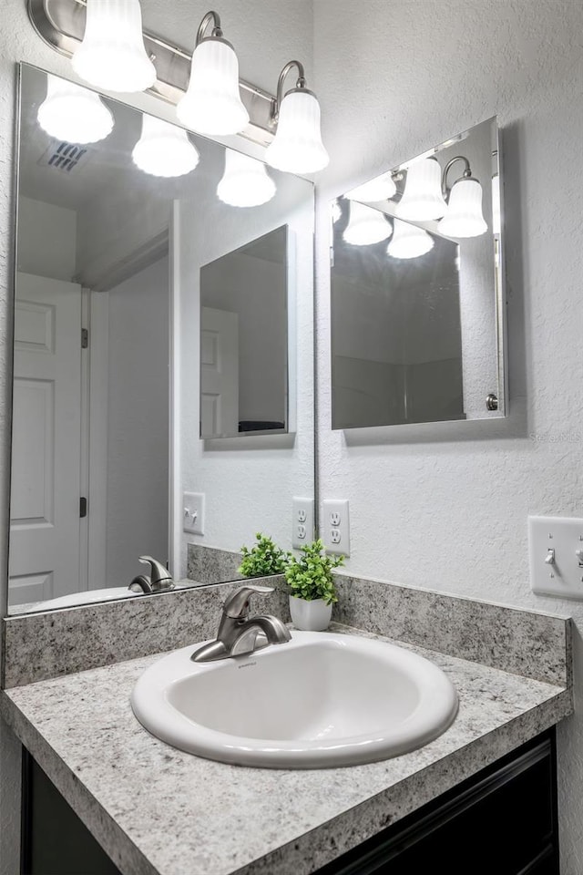 3897 SW 169th Lane Rd, Ocala, FL 34473 - bathroom with vanity and a textured wall