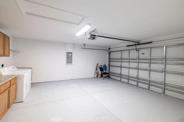 3897 SW 169th Lane Rd, Ocala, FL 34473 - garage with washer and dryer, electric panel, and a garage door opener