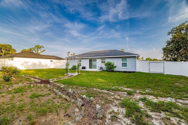 3897 SW 169th Lane Rd, Ocala, FL 34473 - rear view of house with a patio area, a gate, and stucco siding