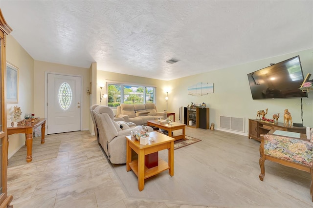 66 S Desoto St, Beverly Hills, FL 34465 - living room featuring a textured ceiling and baseboards