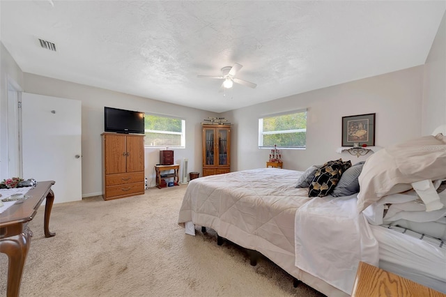 66 S Desoto St, Beverly Hills, FL 34465 - bedroom featuring multiple windows, light carpet, and ceiling fan