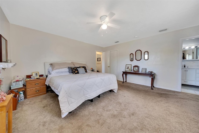 66 S Desoto St, Beverly Hills, FL 34465 - bedroom featuring light carpet, a ceiling fan, and ensuite bathroom