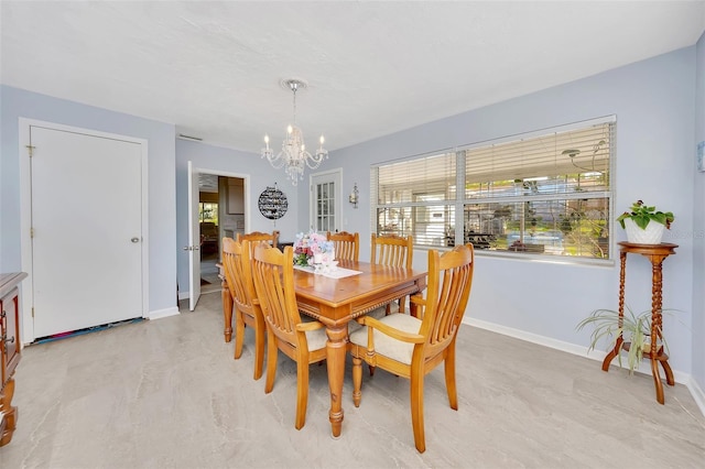66 S Desoto St, Beverly Hills, FL 34465 - dining space featuring a chandelier, healthy amount of natural light, and baseboards