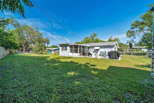 66 S Desoto St, Beverly Hills, FL 34465 - view of yard with a sunroom and a patio