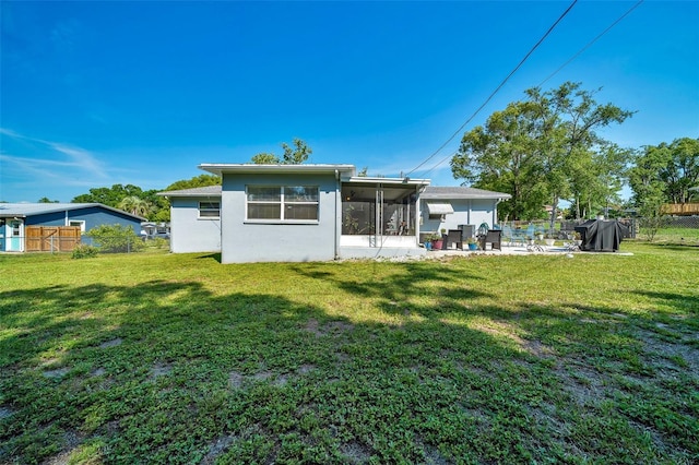 66 S Desoto St, Beverly Hills, FL 34465 - rear view of house featuring a sunroom, stucco siding, and a patio