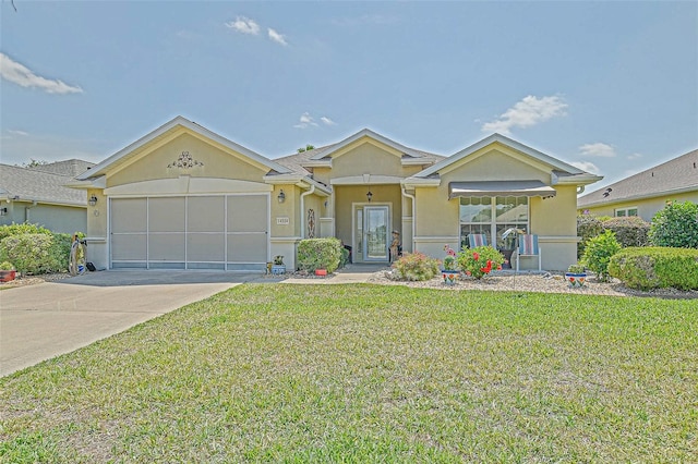 14004 SE 94th Ave, Summerfield, FL 34491 - view of front facade with stucco siding, a front yard, driveway, and a garage