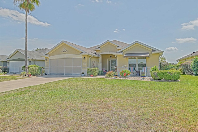 14004 SE 94th Ave, Summerfield, FL 34491 - view of front of house with stucco siding, an attached garage, driveway, and a front yard