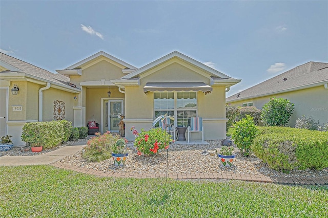 14004 SE 94th Ave, Summerfield, FL 34491 - view of front of house with stucco siding and a front yard