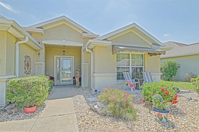 14004 SE 94th Ave, Summerfield, FL 34491 - doorway to property with stucco siding