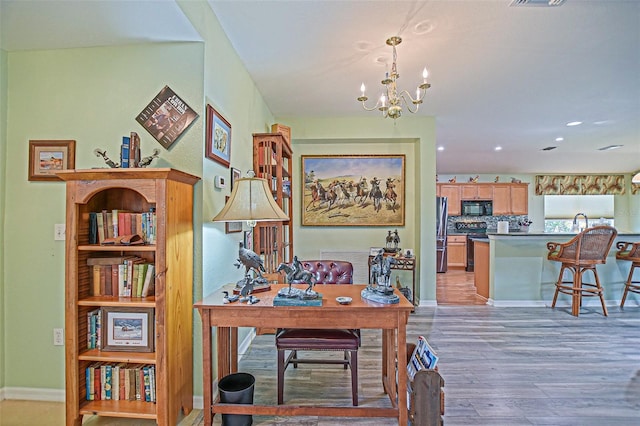 14004 SE 94th Ave, Summerfield, FL 34491 - home office with light wood-style flooring, a chandelier, baseboards, a sink, and recessed lighting