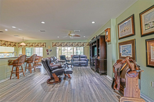 14004 SE 94th Ave, Summerfield, FL 34491 - living room with wood finished floors, a ceiling fan, baseboards, and recessed lighting