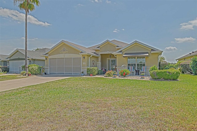14004 SE 94th Ave, Summerfield, FL 34491 - view of front of house featuring stucco siding, driveway, an attached garage, and a front yard