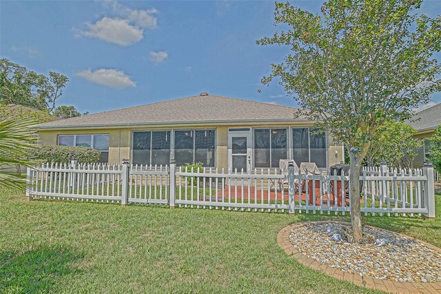 14004 SE 94th Ave, Summerfield, FL 34491 - back of property with a sunroom and stucco siding