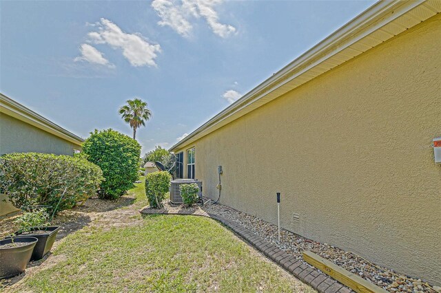 14004 SE 94th Ave, Summerfield, FL 34491 - view of green lawn with cooling unit