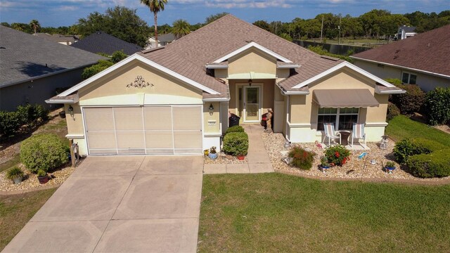 14004 SE 94th Ave, Summerfield, FL 34491 - ranch-style house with concrete driveway, a garage, a front lawn, and stucco siding