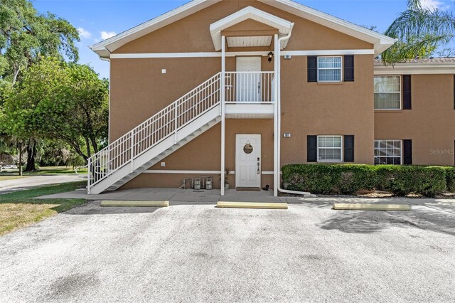 4450 E Windmill Dr Unit 101, Inverness, FL 34453 - view of building exterior featuring uncovered parking