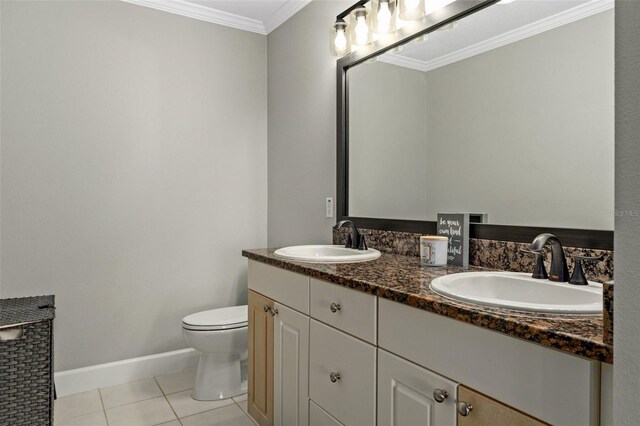 4450 E Windmill Dr Unit 101, Inverness, FL 34453 - bathroom featuring double vanity, ornamental molding, tile patterned flooring, toilet, and baseboards