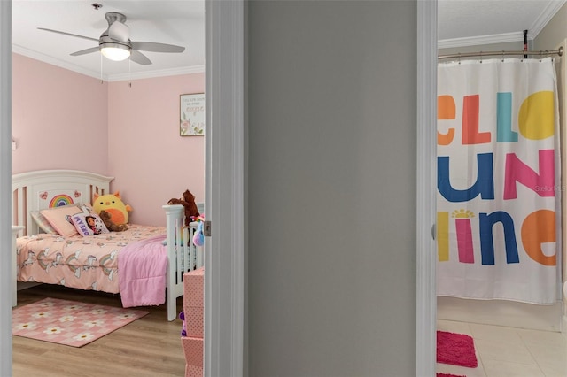 4450 E Windmill Dr Unit 101, Inverness, FL 34453 - bedroom featuring crown molding, wood finished floors, and ceiling fan