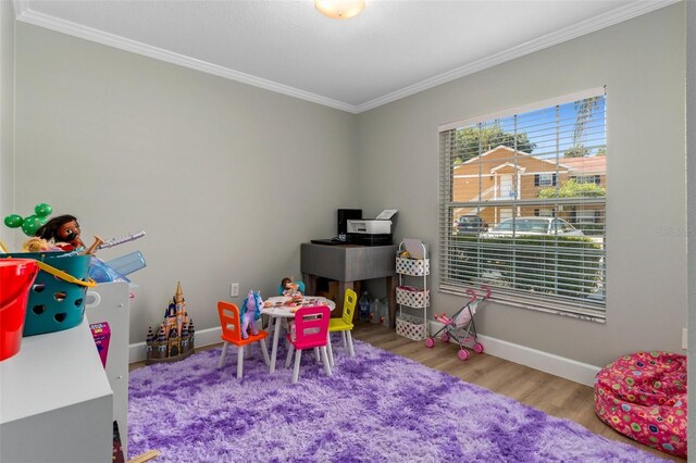 4450 E Windmill Dr Unit 101, Inverness, FL 34453 - game room featuring crown molding, wood finished floors, and baseboards
