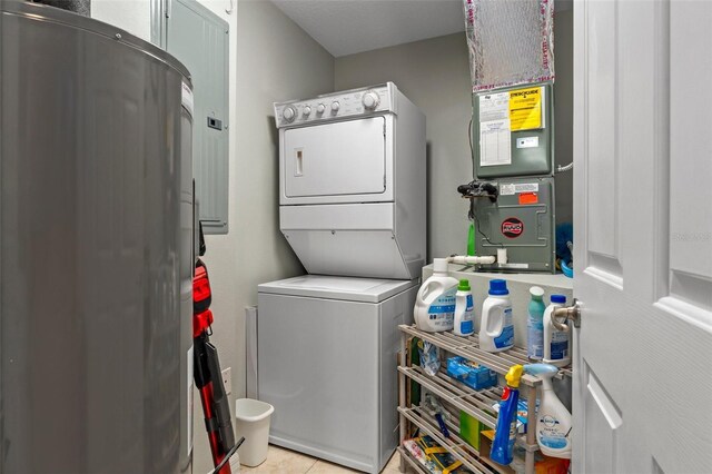 4450 E Windmill Dr Unit 101, Inverness, FL 34453 - laundry room with stacked washer / drying machine and light tile patterned flooring