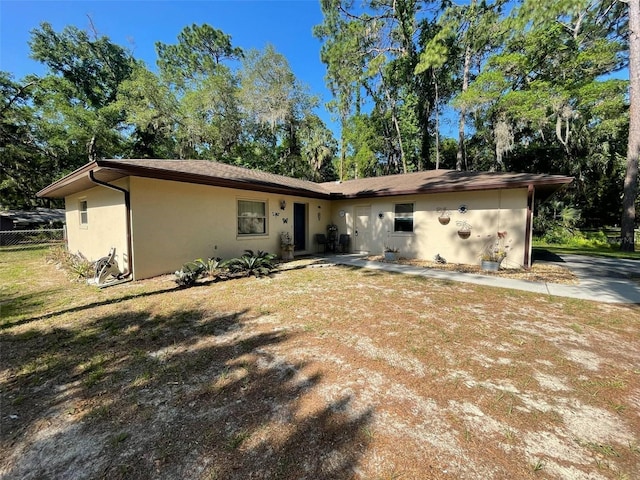 9740 W Cranberry St, Crystal River, FL 34428 - rear view of house with stucco siding