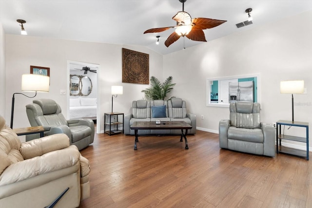 9740 W Cranberry St, Crystal River, FL 34428 - living room with ceiling fan, wood finished floors, baseboards, and vaulted ceiling