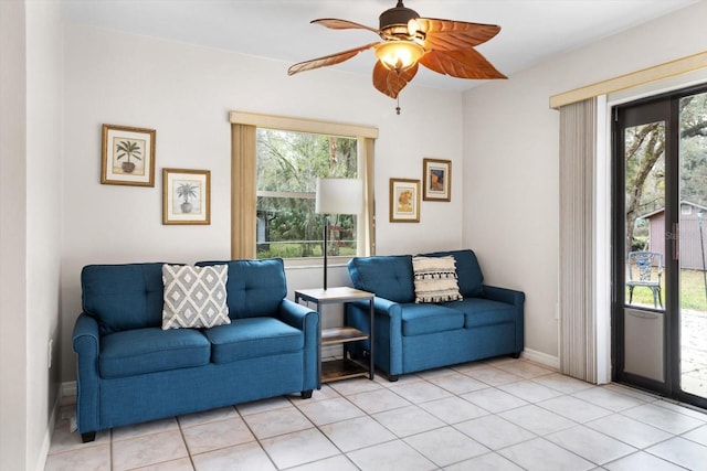 9740 W Cranberry St, Crystal River, FL 34428 - living room with ceiling fan, light tile patterned flooring, and baseboards