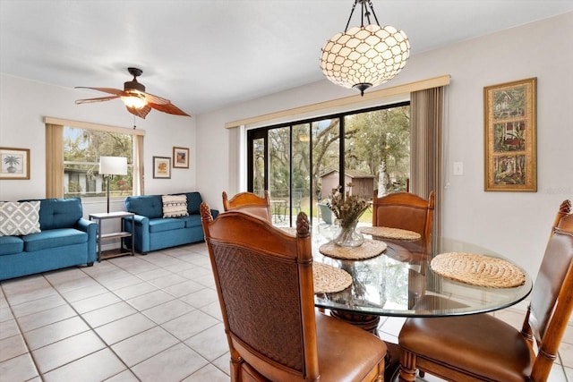 9740 W Cranberry St, Crystal River, FL 34428 - dining space with light tile patterned flooring, a ceiling fan, and healthy amount of natural light