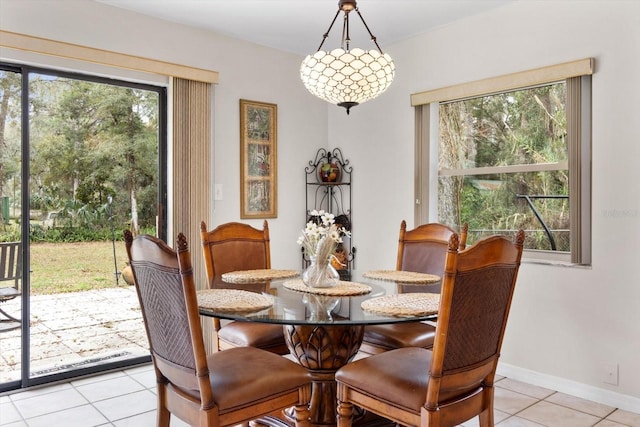 9740 W Cranberry St, Crystal River, FL 34428 - dining room with light tile patterned floors and baseboards