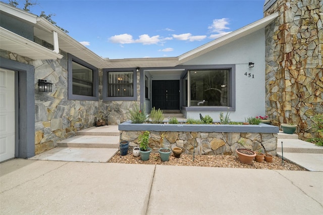 451 E Ireland Ct, Hernando, FL 34442 - property entrance featuring stone siding and stucco siding