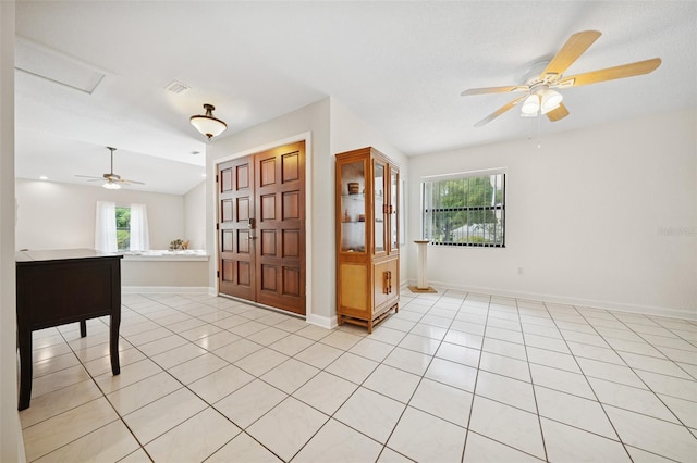 451 E Ireland Ct, Hernando, FL 34442 - unfurnished room with plenty of natural light, light tile patterned floors, ceiling fan, and baseboards