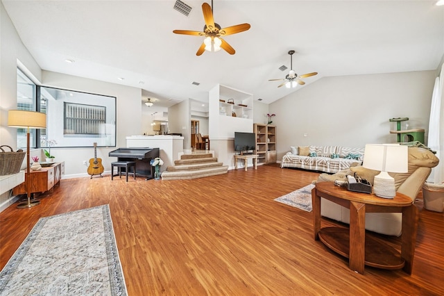 451 E Ireland Ct, Hernando, FL 34442 - living room featuring a ceiling fan, wood finished floors, vaulted ceiling, and baseboards
