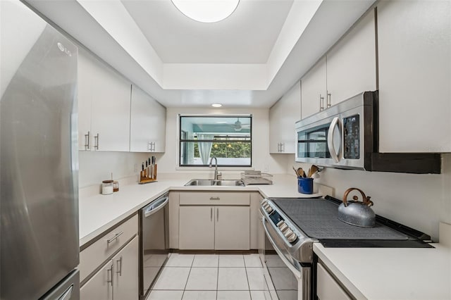 451 E Ireland Ct, Hernando, FL 34442 - kitchen with appliances with stainless steel finishes, a sink, light tile patterned flooring, and light countertops
