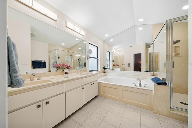 451 E Ireland Ct, Hernando, FL 34442 - bathroom featuring a stall shower, tile patterned flooring, a bath, double vanity, and lofted ceiling