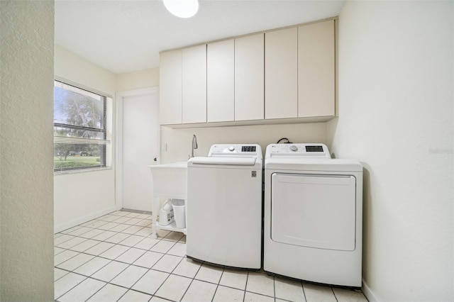 451 E Ireland Ct, Hernando, FL 34442 - laundry room featuring cabinet space, washer and dryer, light tile patterned floors, and baseboards