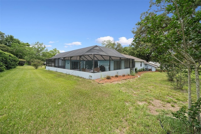 451 E Ireland Ct, Hernando, FL 34442 - back of property featuring a yard and glass enclosure