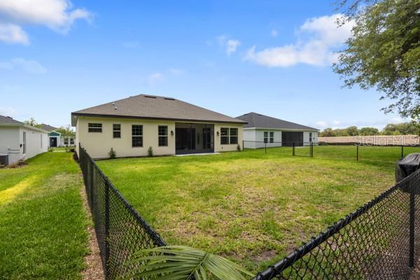 6235 SW 95th Pl, Ocala, FL 34476 - back of house with cooling unit
