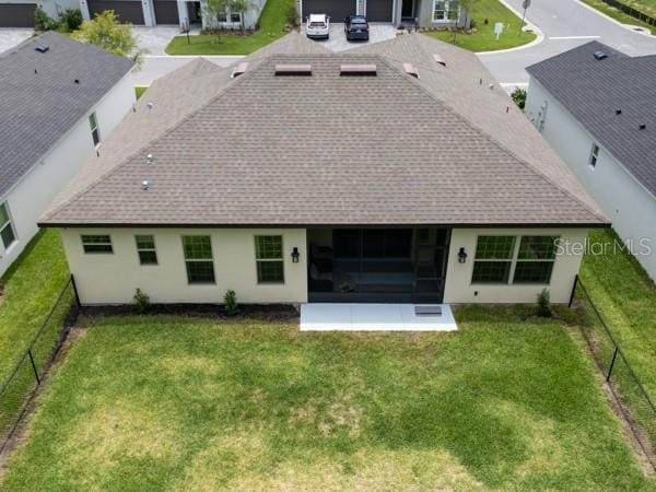 6235 SW 95th Pl, Ocala, FL 34476 - back of house featuring roof with shingles, a sunroom, and stucco siding