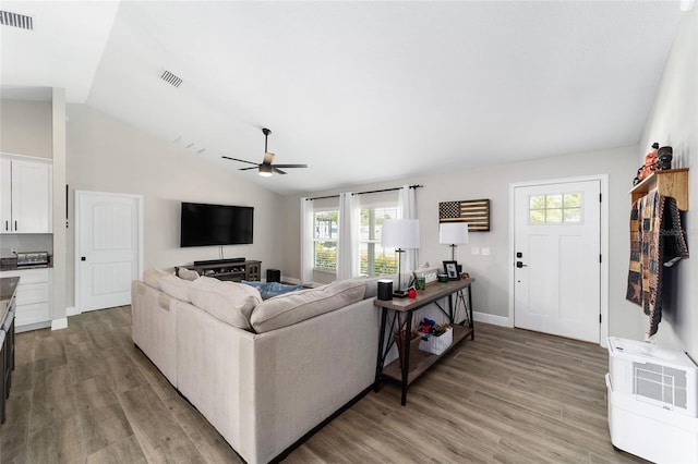 7442 SW 129th Ln, Ocala, FL 34473 - living area with vaulted ceiling, healthy amount of natural light, ceiling fan, and wood finished floors