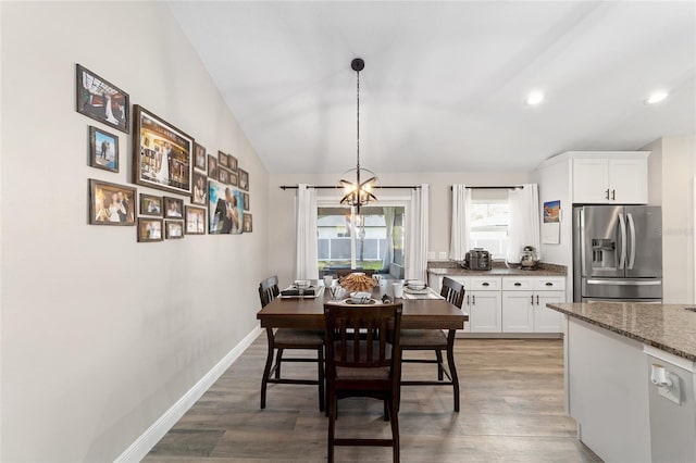7442 SW 129th Ln, Ocala, FL 34473 - dining room with vaulted ceiling, a chandelier, wood finished floors, recessed lighting, and baseboards