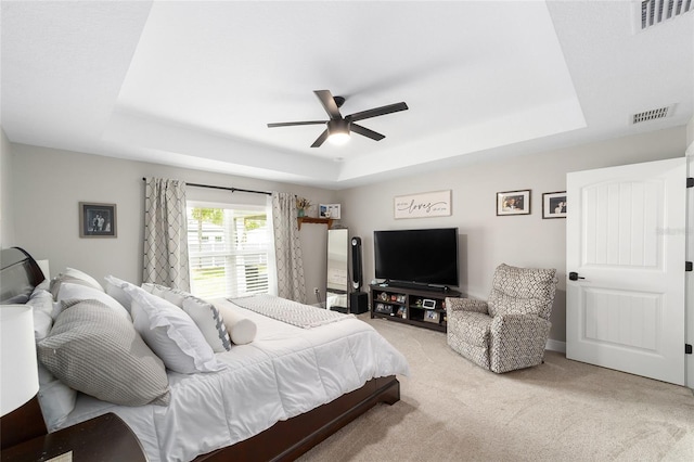 7442 SW 129th Ln, Ocala, FL 34473 - bedroom with a tray ceiling, light colored carpet, and ceiling fan